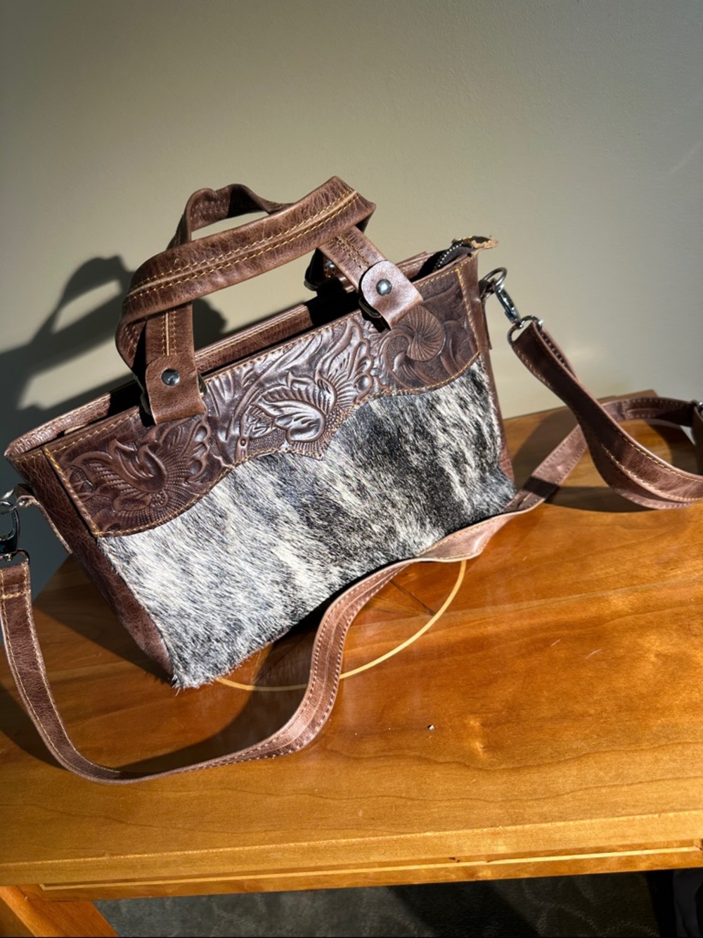 Hand tooled leather and fur hide hand bag.